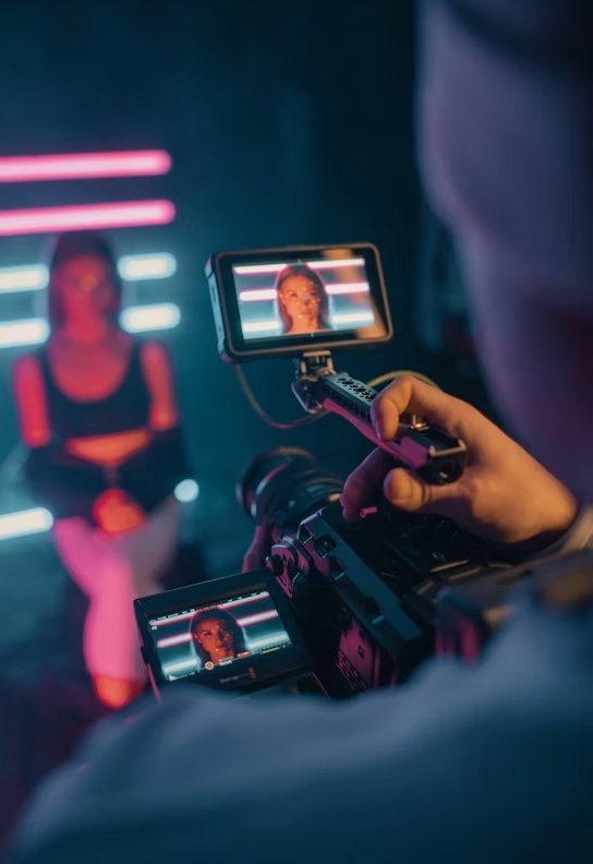 Production camera filming campaign talent